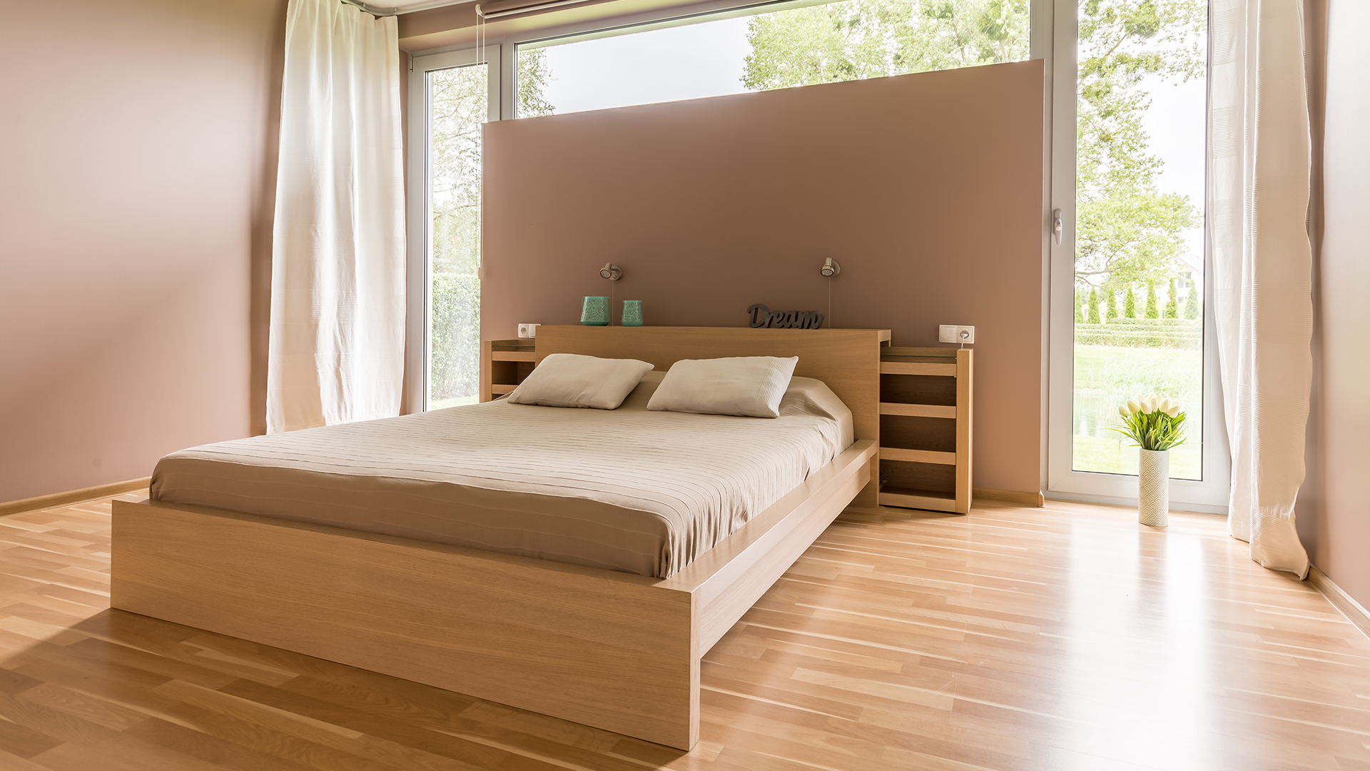 Big,And,Spacious,Bed,With,Beige,Duvet